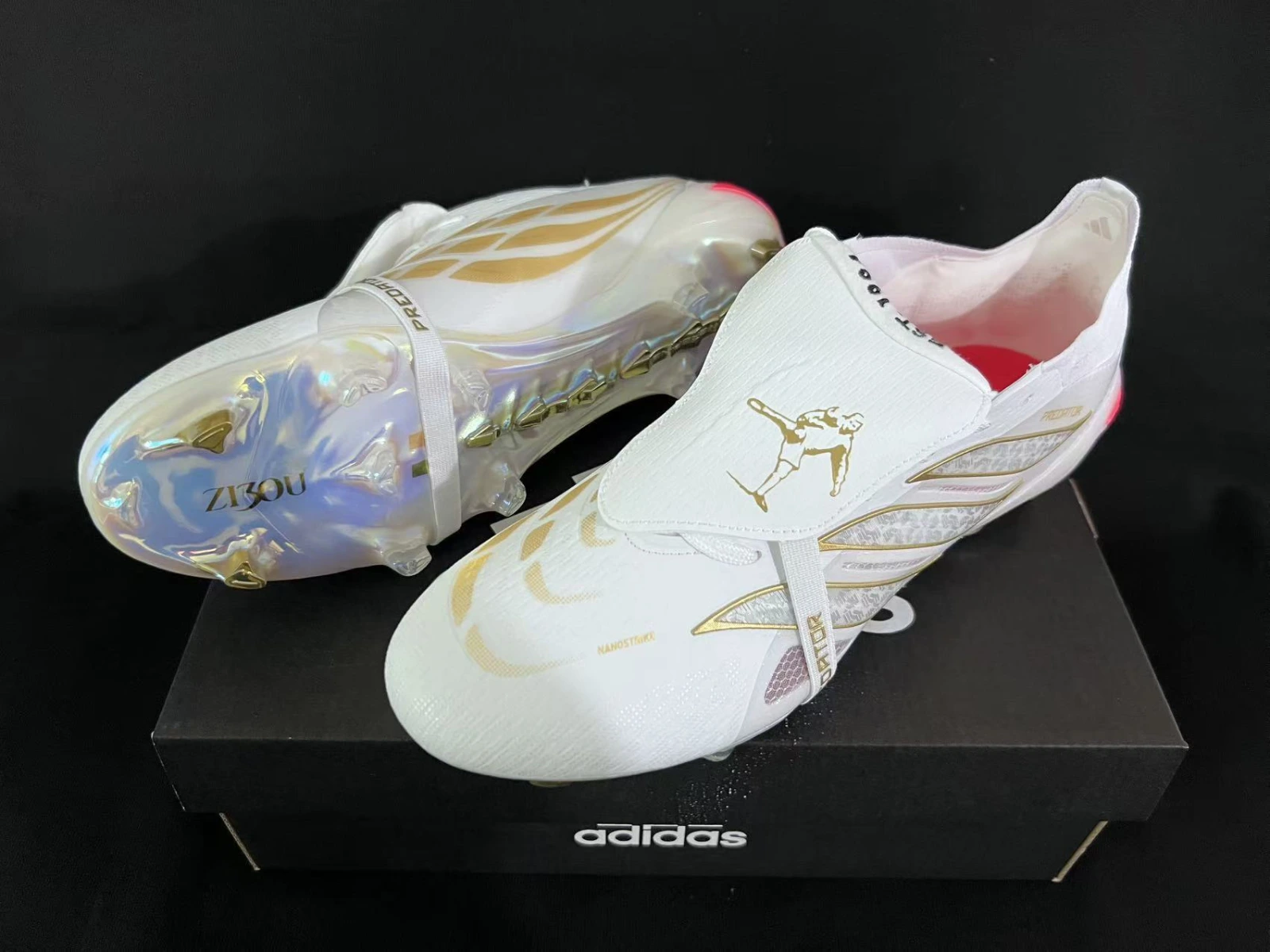 Close‑up of the tongue lifted to reveal Zidane’s volley silhouette